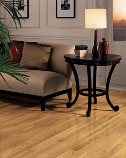 luxury vinyl plank in living room with side table and red accents